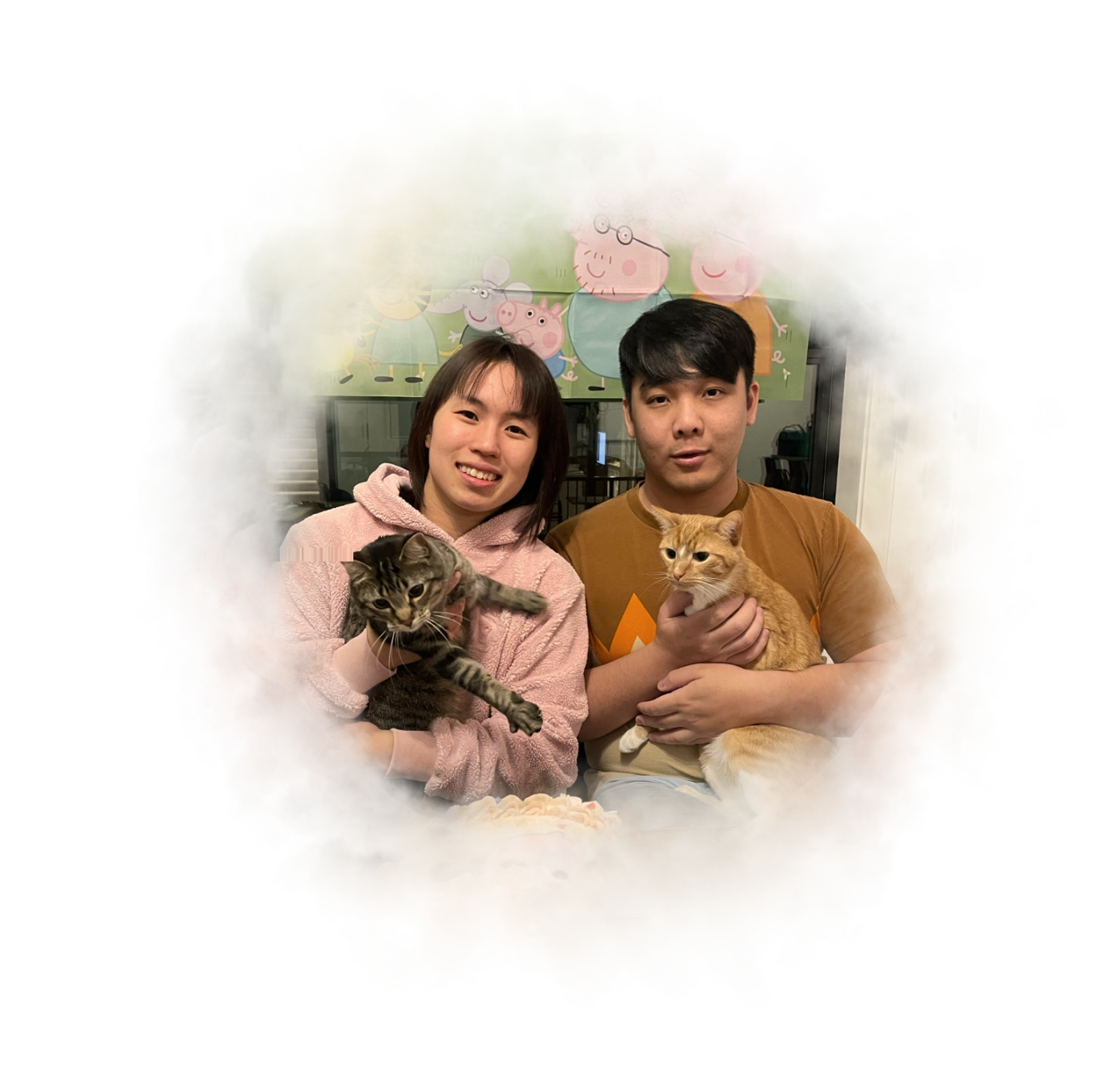 A photo of Kaming and Claudia with their cat TseTse and DiDi